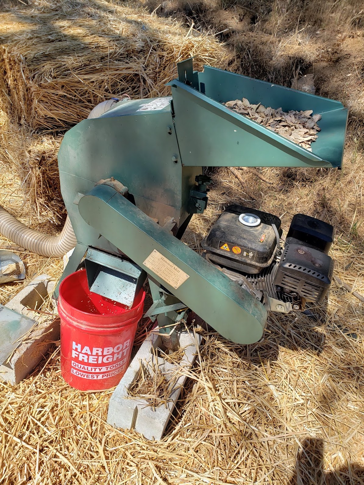 picture of a hammer mill grinding wood chips